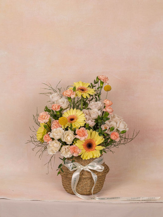 The Daisy basket, a cheerful white and green arrangement from Adore Flowers