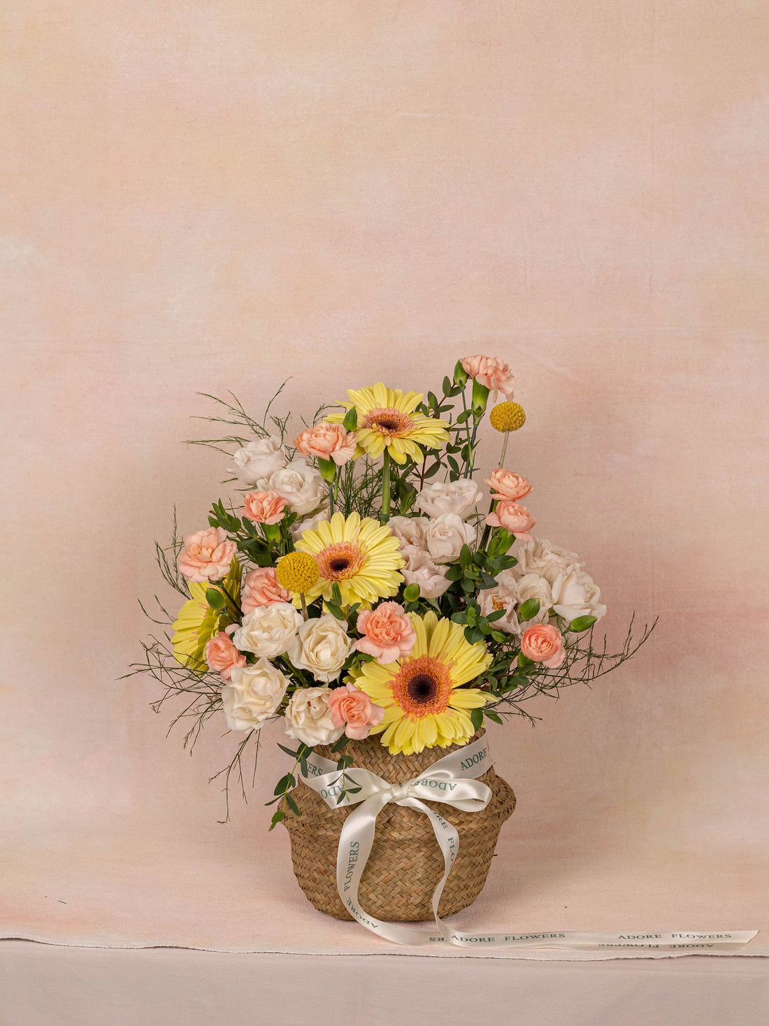 The Daisy basket, a cheerful white and green arrangement from Adore Flowers