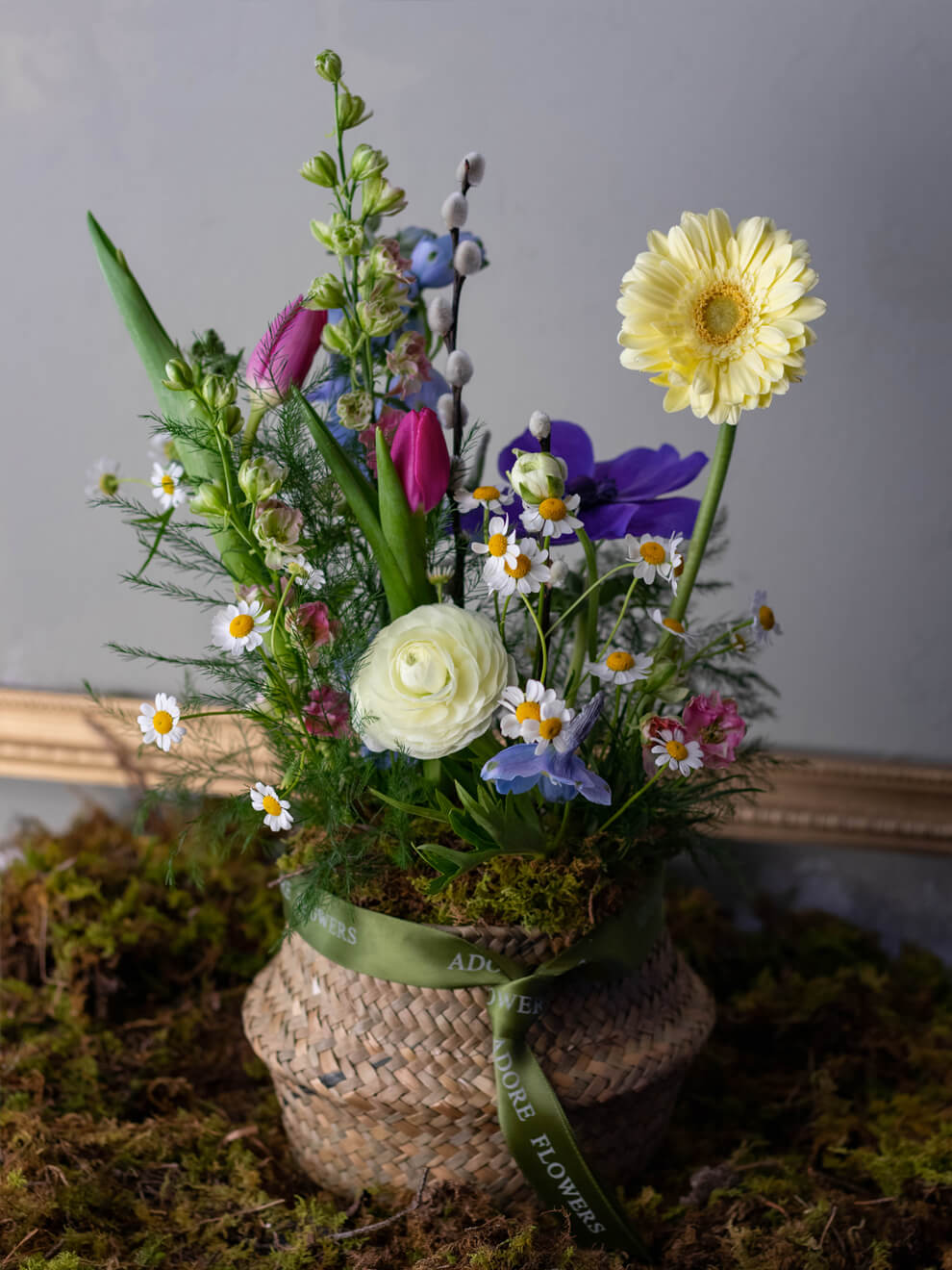 Spring Basket - Vibrant Tulips, Feverfew Daisies, and Ranunculus in Lush Greenery