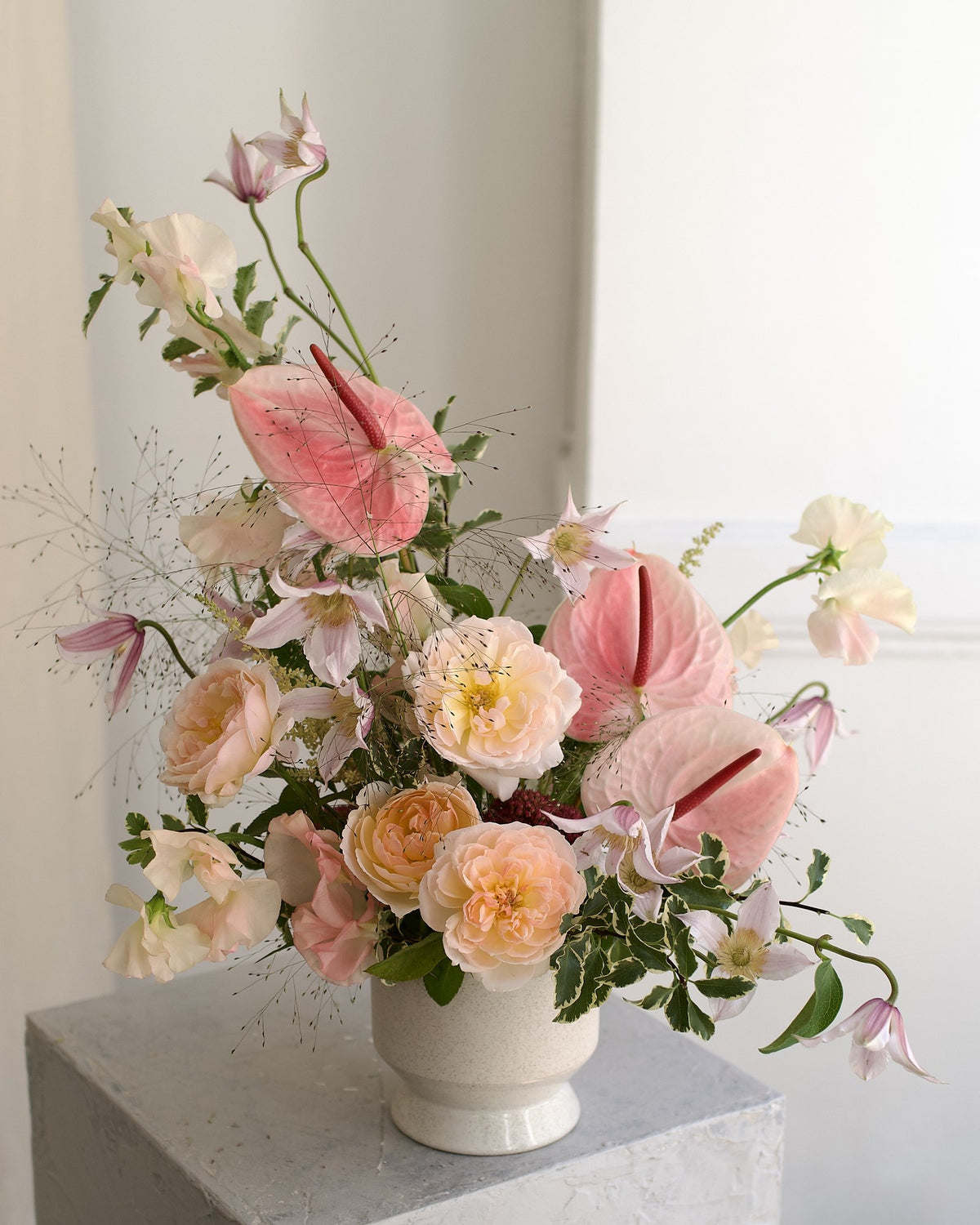 Delicate Blushes vase arrangement variation, peach garden roses, pink anthurium, clematis and sweet peas in a cream ceramic vase, Adore Flowers Los Angeles