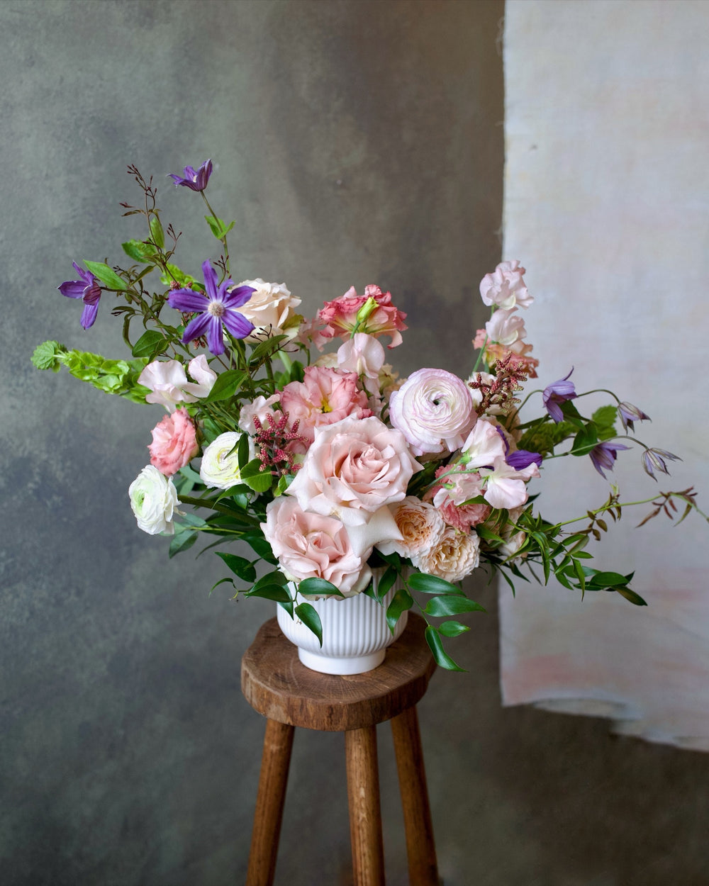 Delicate Blushes arrangement in a stone vase, blush and cream garden flowers, same-day delivery Los Angeles