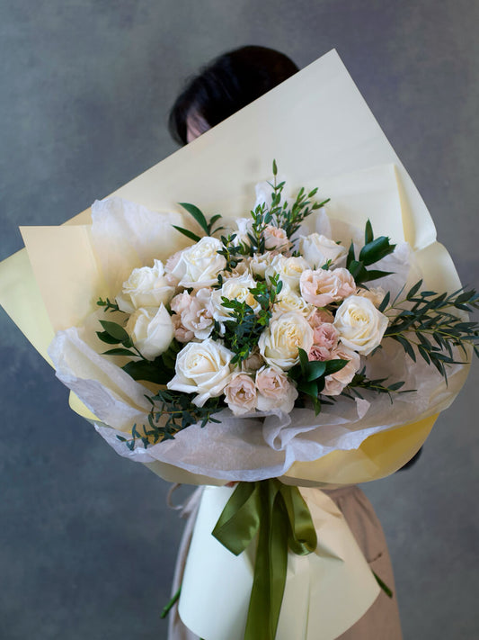 white roses and spray roses