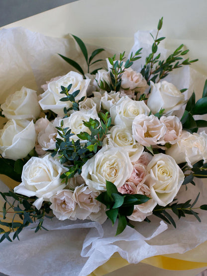 white roses and spray roses close up