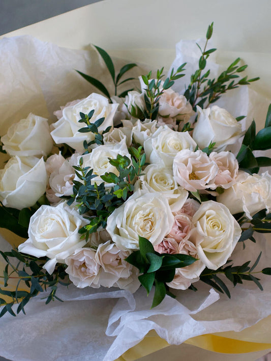 white roses and spray roses close up